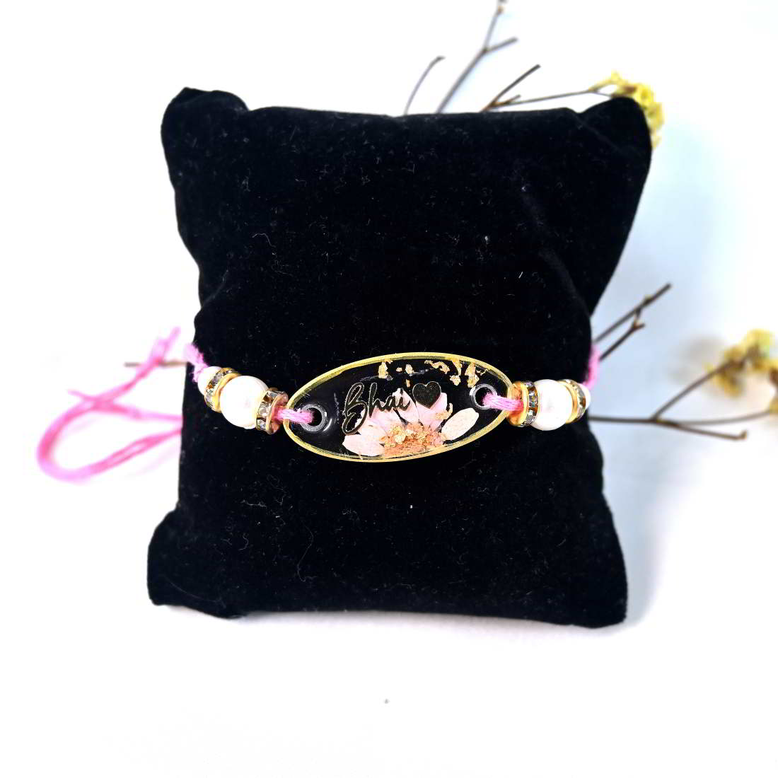 Beautiful Transparent With Original Pink Flower With Golden Text Bhai With Beautiful Heart Rakhi