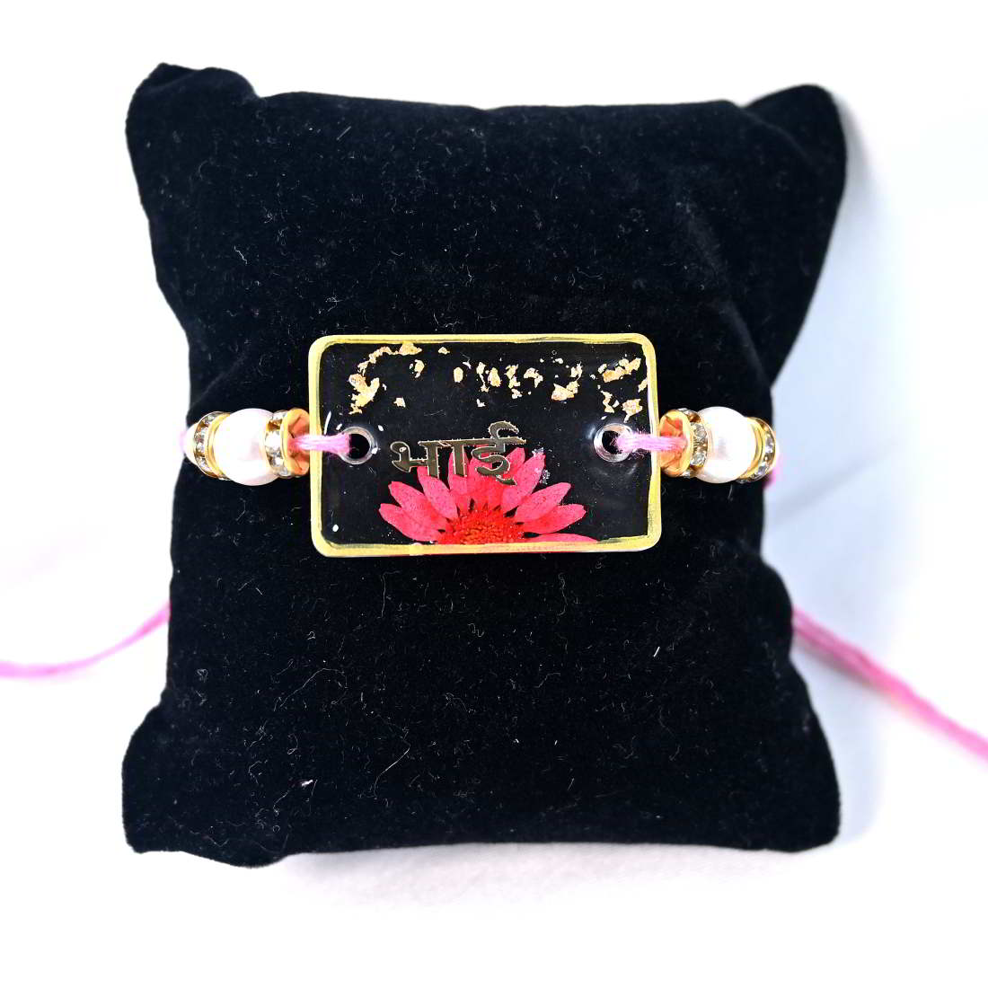 Beautiful Transparent Rakhi With Pink Flower Golden Text Bhai  