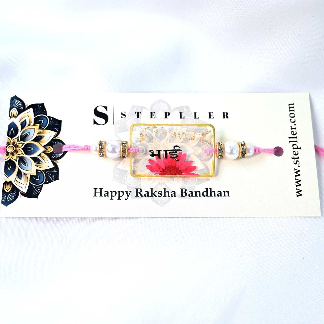 Beautiful Transparent Rakhi With Pink Flower Golden Text Bhai